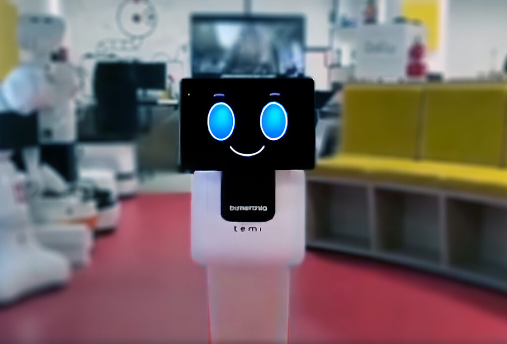 Yksinkertainen robotti, jonka kasvot on hymynaama ruudulla.